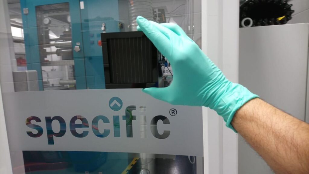 Perovskite Solar Cells Set a New Efficiency Record Solar panels and laboratory equipment under bright light